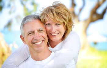 Cheerful mature couple with perfect smiles.